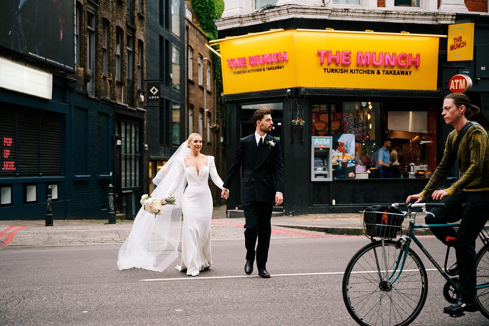 Newlyweds celebrating with guests at their wedding reception